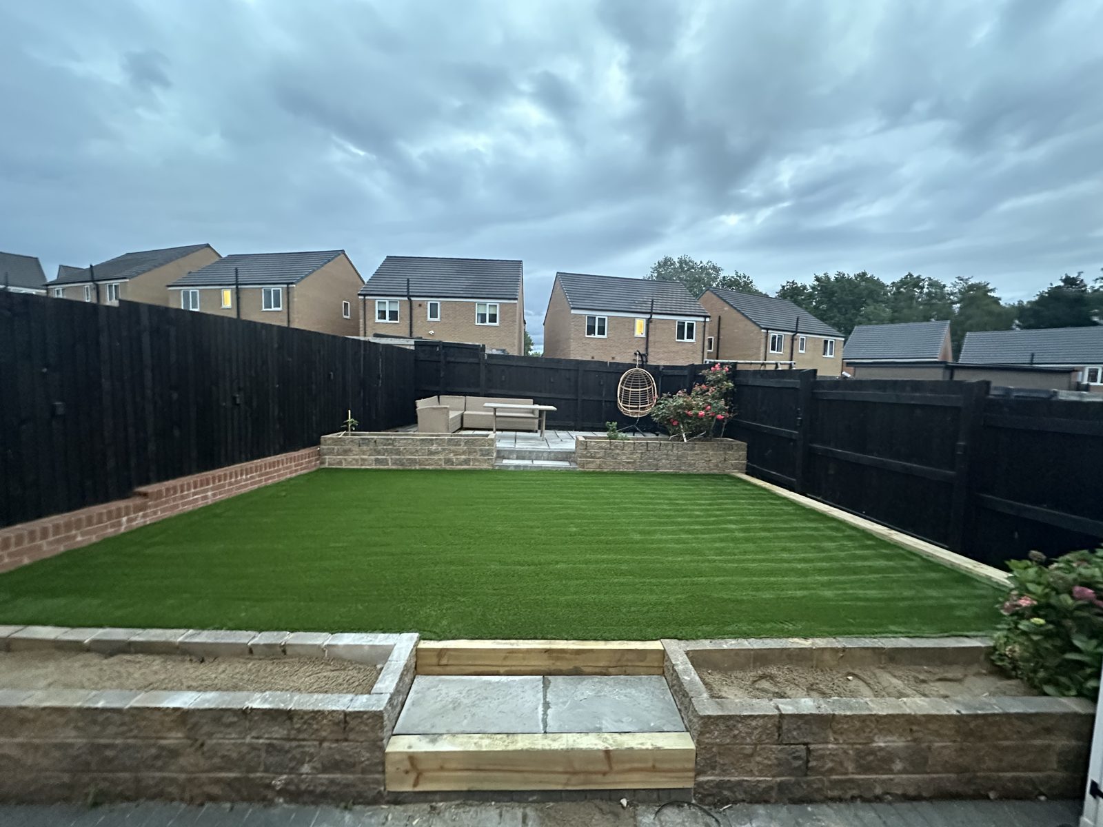Newly installed artificial grass lawn in a Bolton garden