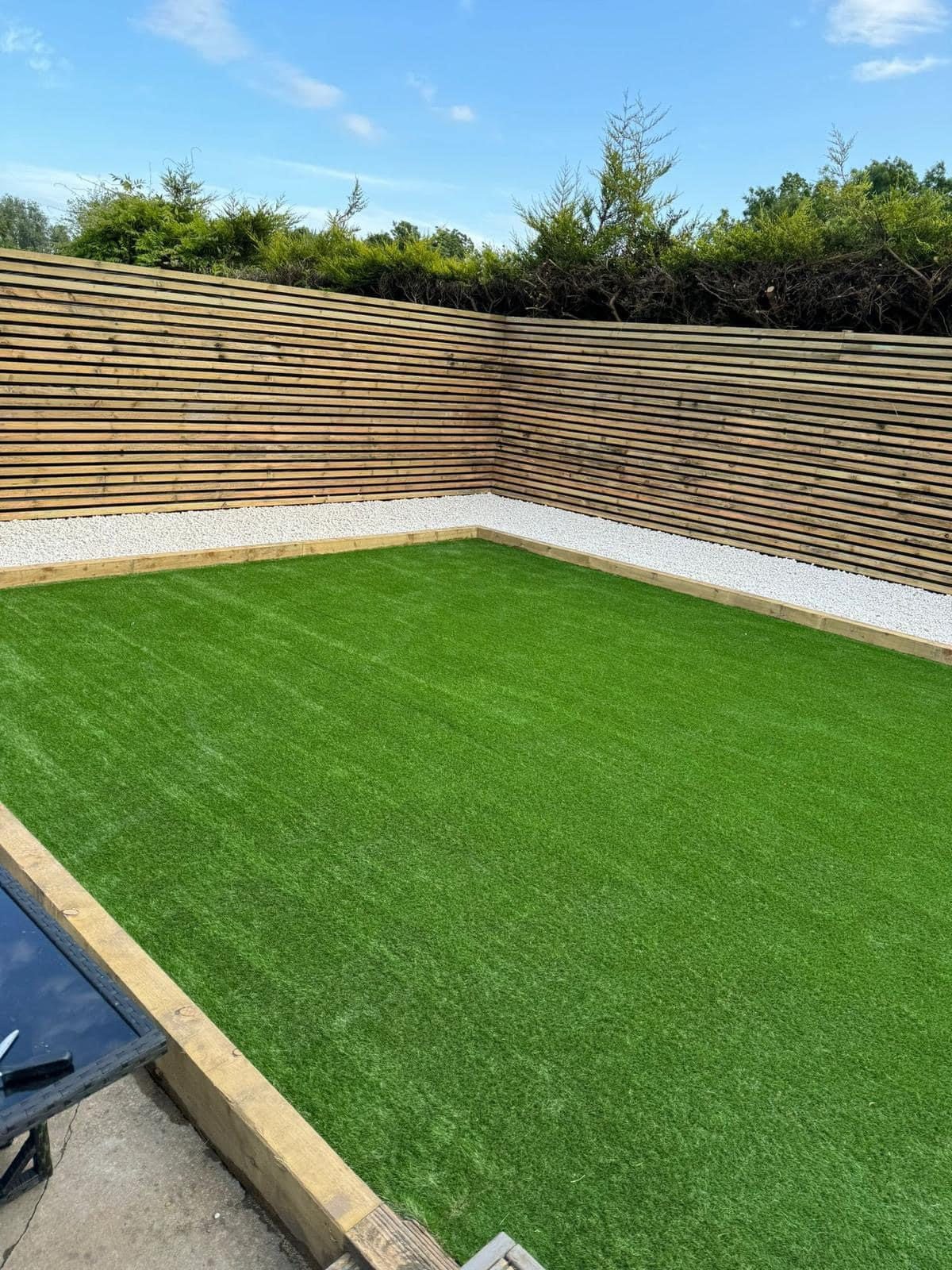 Artificial grass lawn with new fencing in a Bolton garden