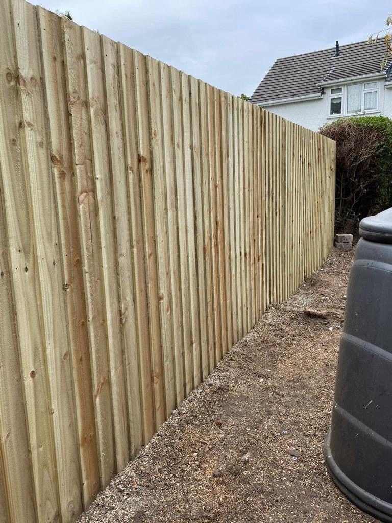 New closeboard fencing installed along a garden boundary