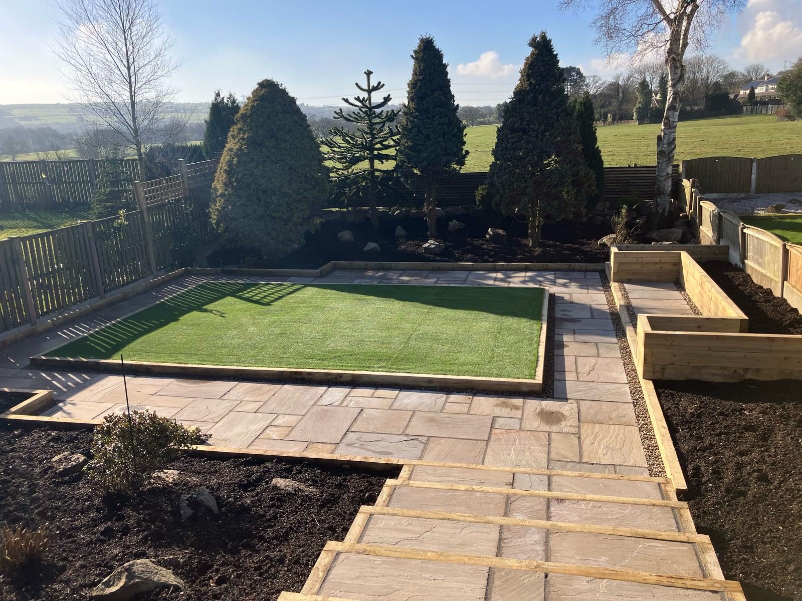 Finished garden with new lawn and patio by Northwest Elite Scaping, Bolton