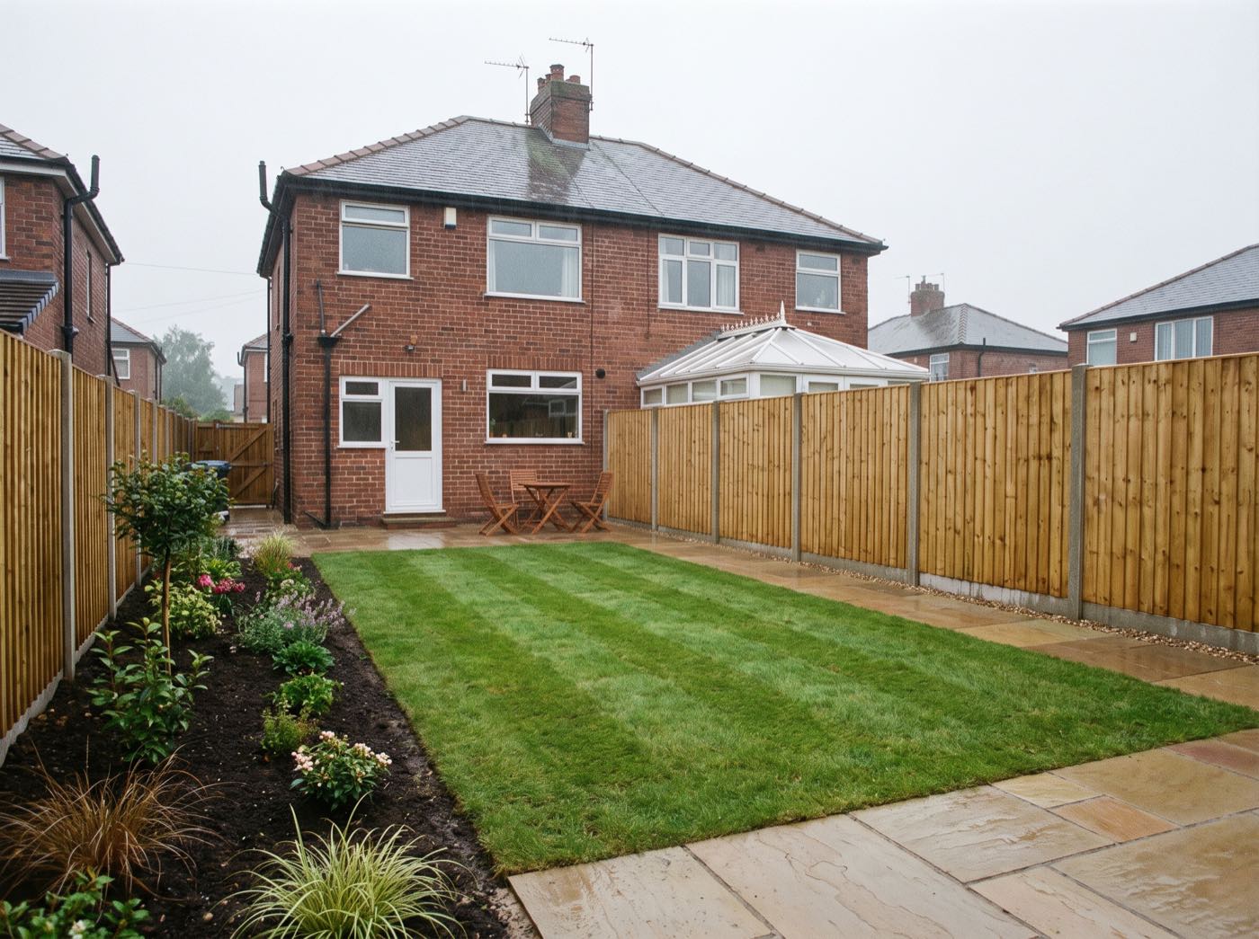 Finished back garden in Astley after landscaping, with a new patio, lawn and fence (illustrative)
