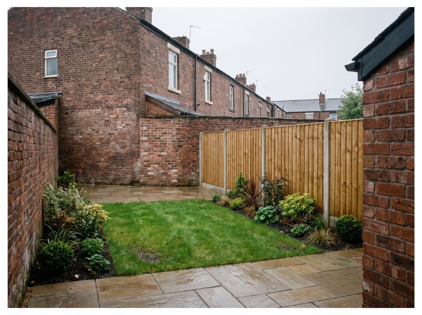 Finished back garden in Chorley after landscaping, with a new patio, lawn and fence (illustrative)